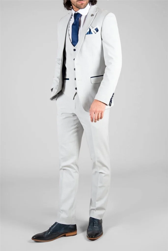 A modern slim-fit suit in a refined stone check pattern, offering a stylish and versatile option for a contemporary groom.
