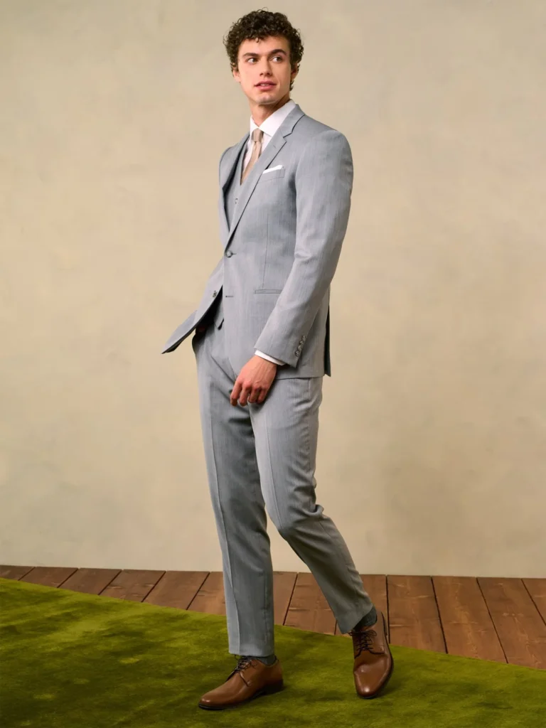 A polished grey suit with a tailored fit, ideal for a sophisticated and effortlessly classic wedding ensemble.