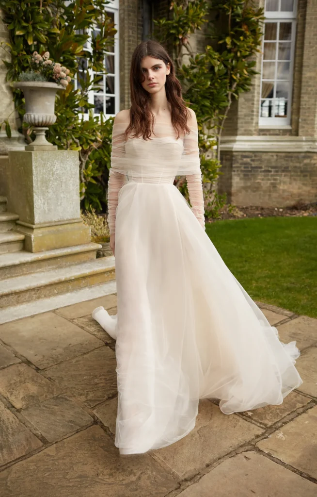 A sophisticated A-line wedding dress with exquisite detailing, premium fabrics, and a couture finish.