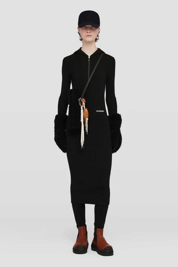 Cozy and stylish mid-length wool knit dress, a modern update to the Little Black Dress, embodying the timeless elegance that Chanel first made iconic.
