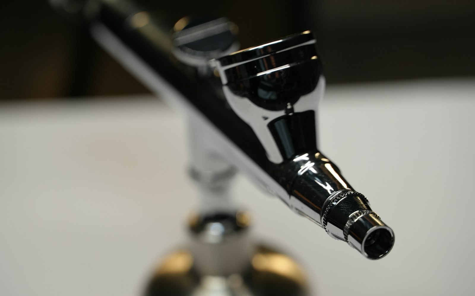Close-up of a black airbrush nozzle