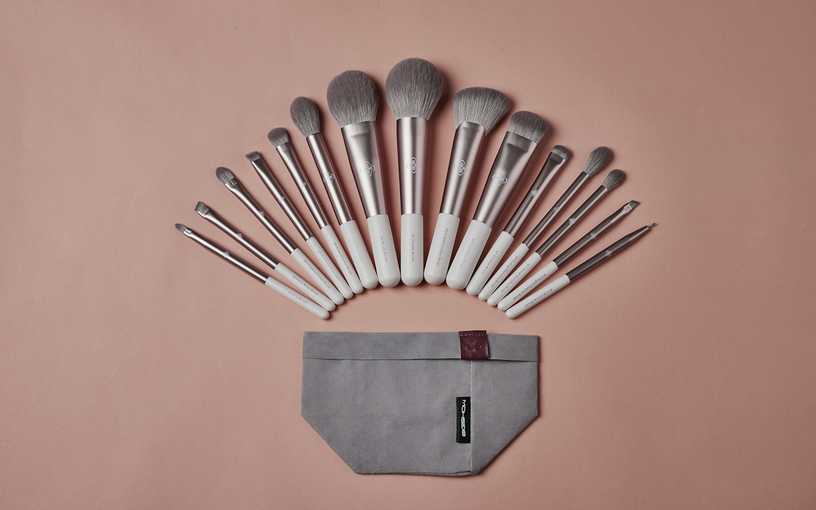 Set of makeup brushes resting on a pouch