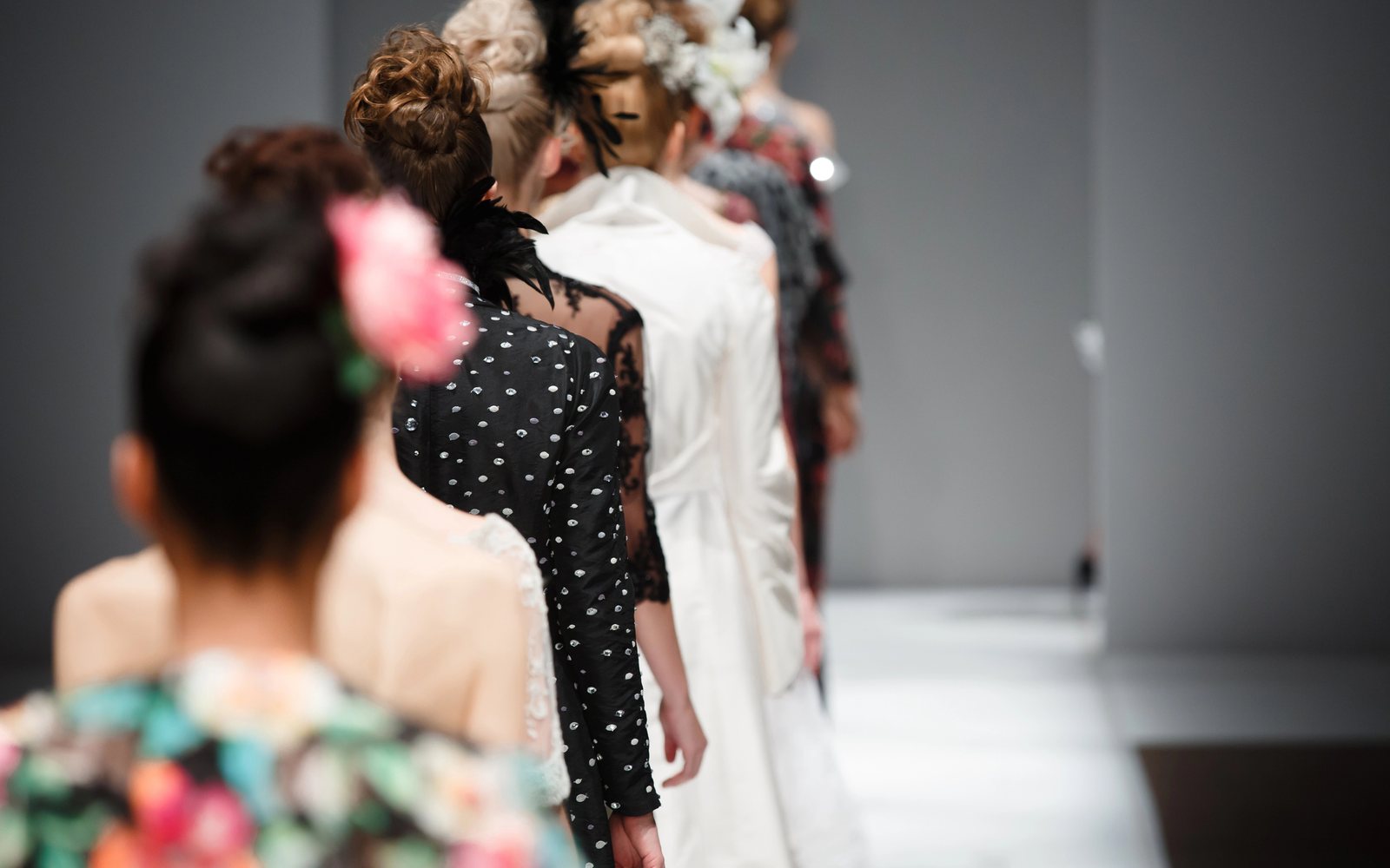 Models lined up backstage before a runway show
