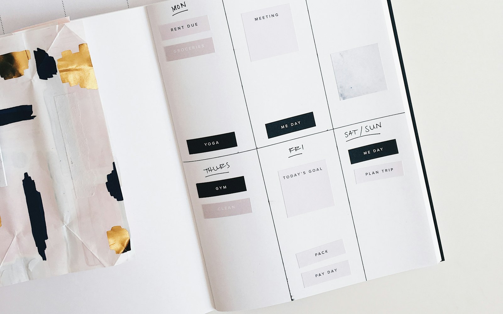 Open weekly planner with handwritten labels