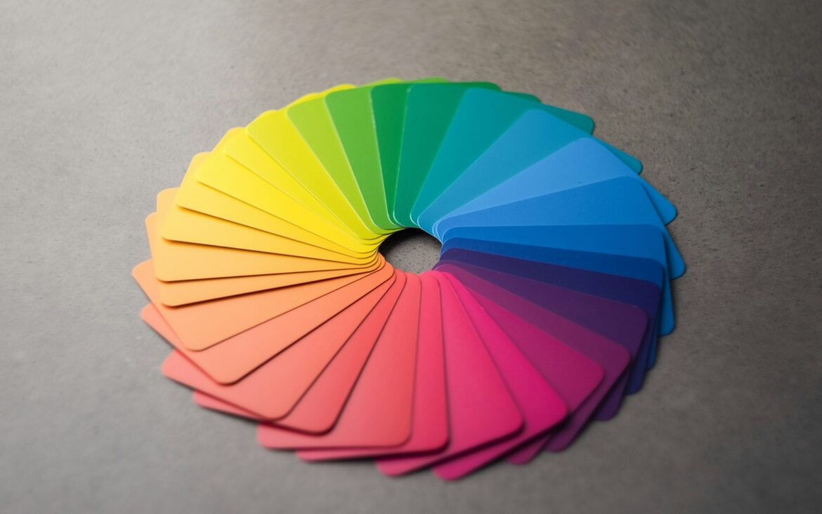 Fan of color swatch cards arranged as a color wheel