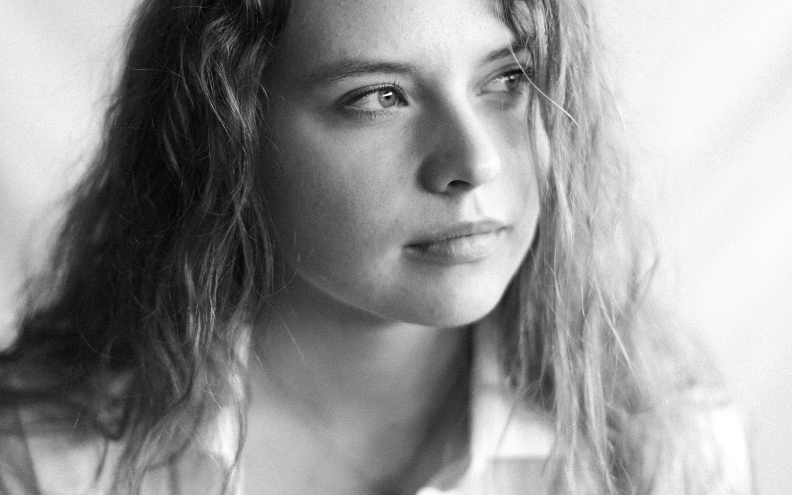 Black-and-white portrait of a woman with natural makeup
