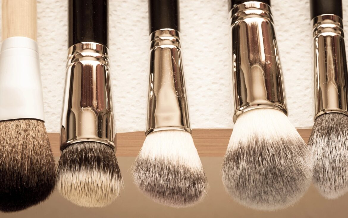 Clean makeup brushes standing upright to dry