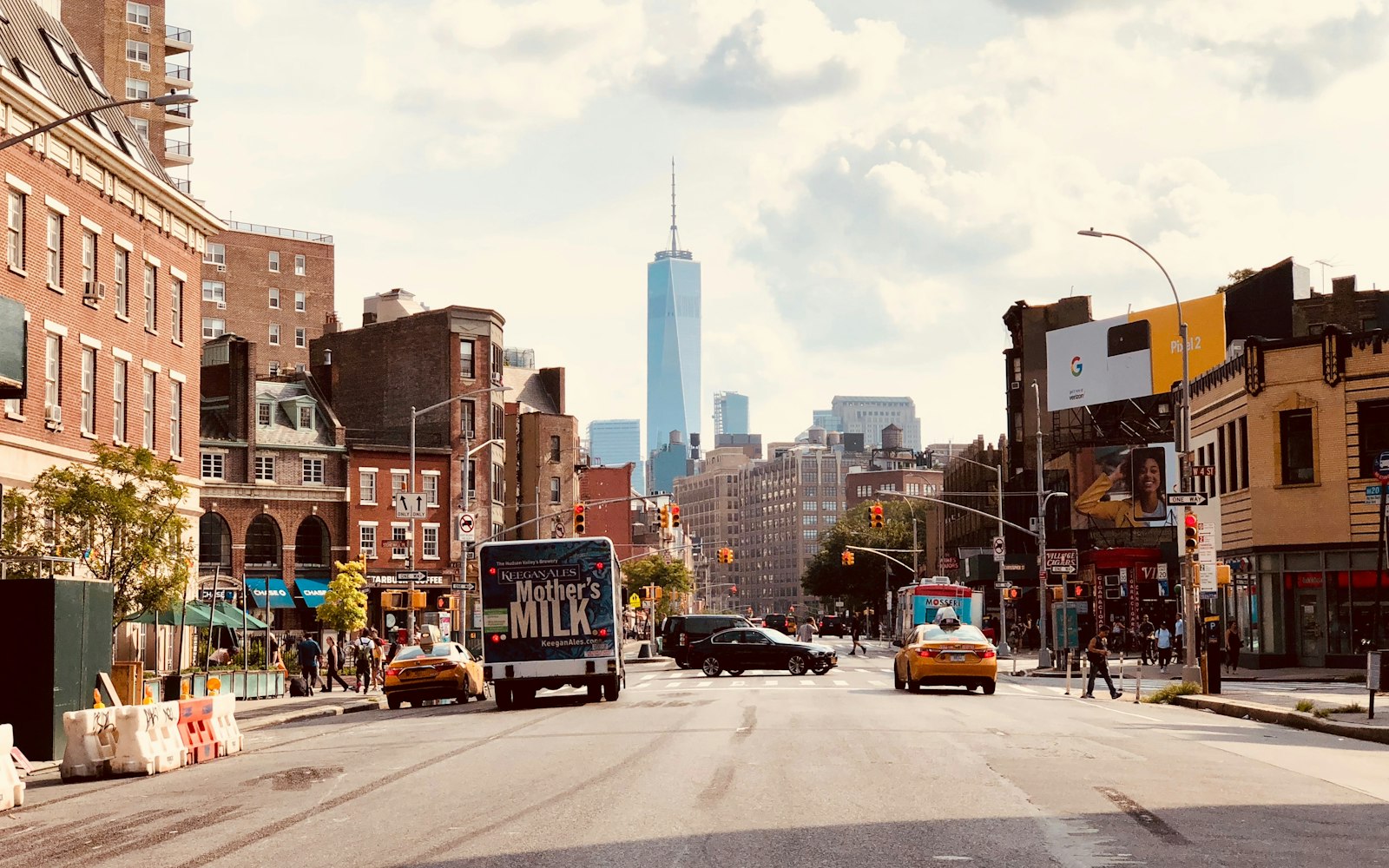 New York street with yellow taxis and the downtown skyline